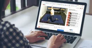 Watching movement education video on laptop