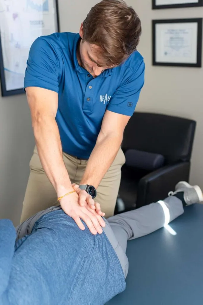 Chiropractic treatment combined with massage therapy at REACH Rehab + Chiropractic in Plymouth, MI