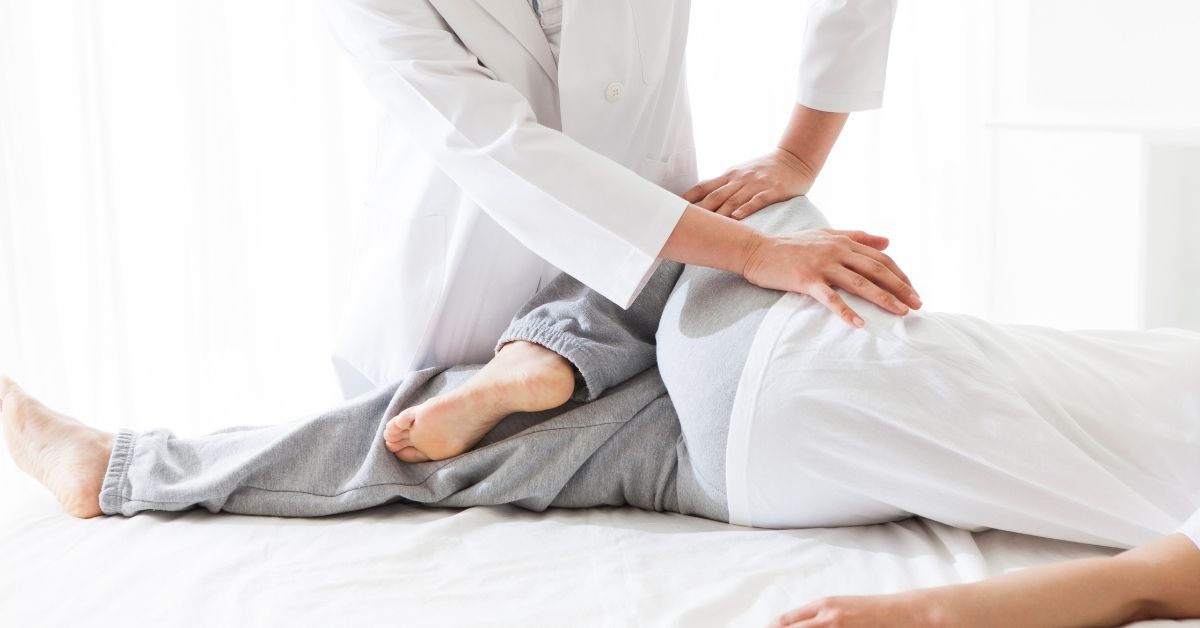 Massage Therapist Helping Stretch