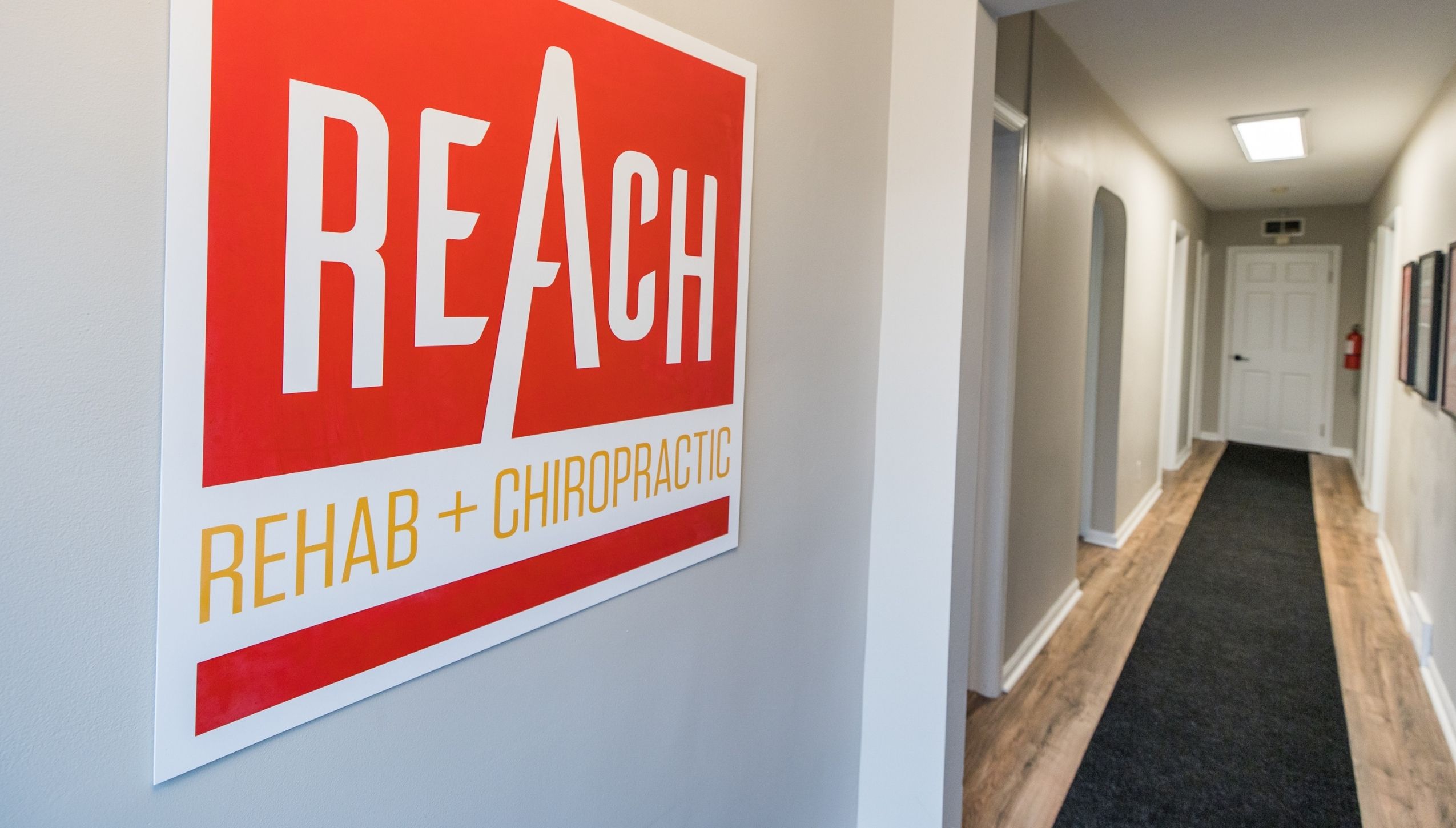 REACH Rehab Sign In Hallway | Chiropractor Near Ann Arbor, MI