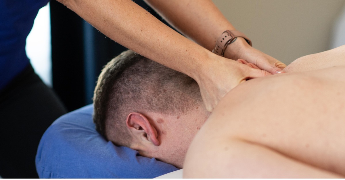 Massage Therapist Massaging a Patient's Shoulders | Should Pain Relief | REACH Rehab + Chiropractic