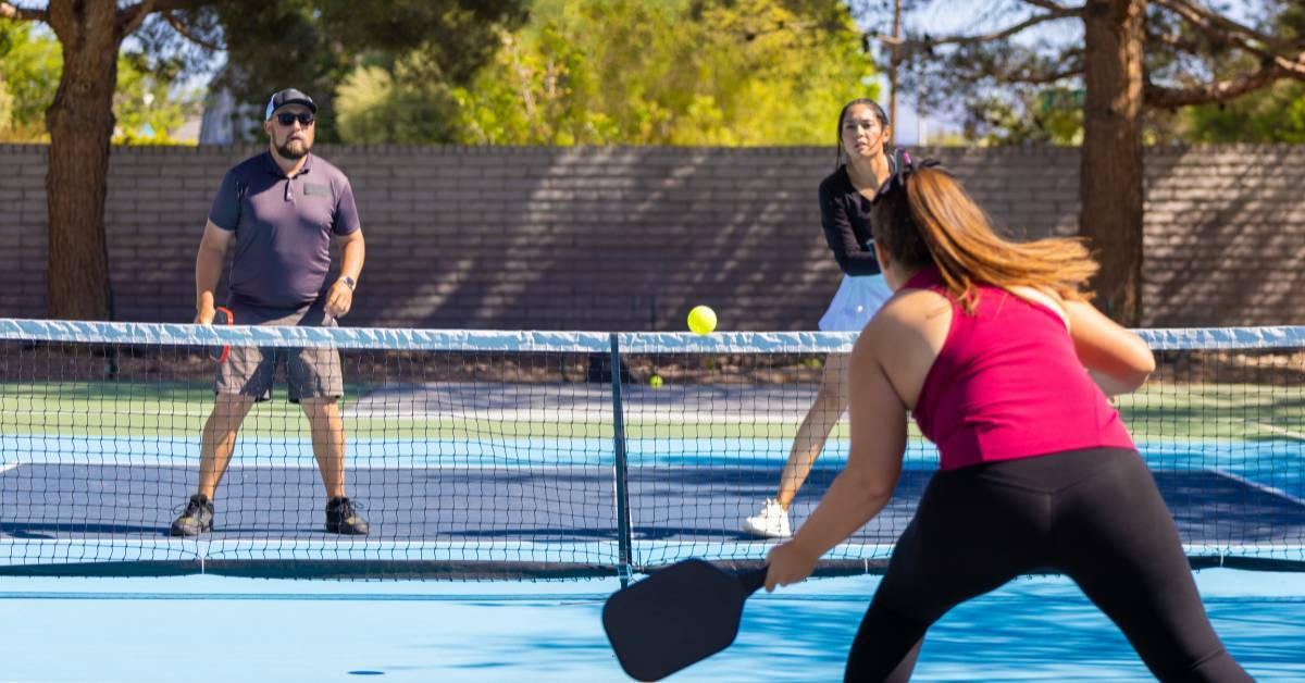 people playing pickleball. how chiropractic care helps pickleball. REACH Rehab + Chiropractic