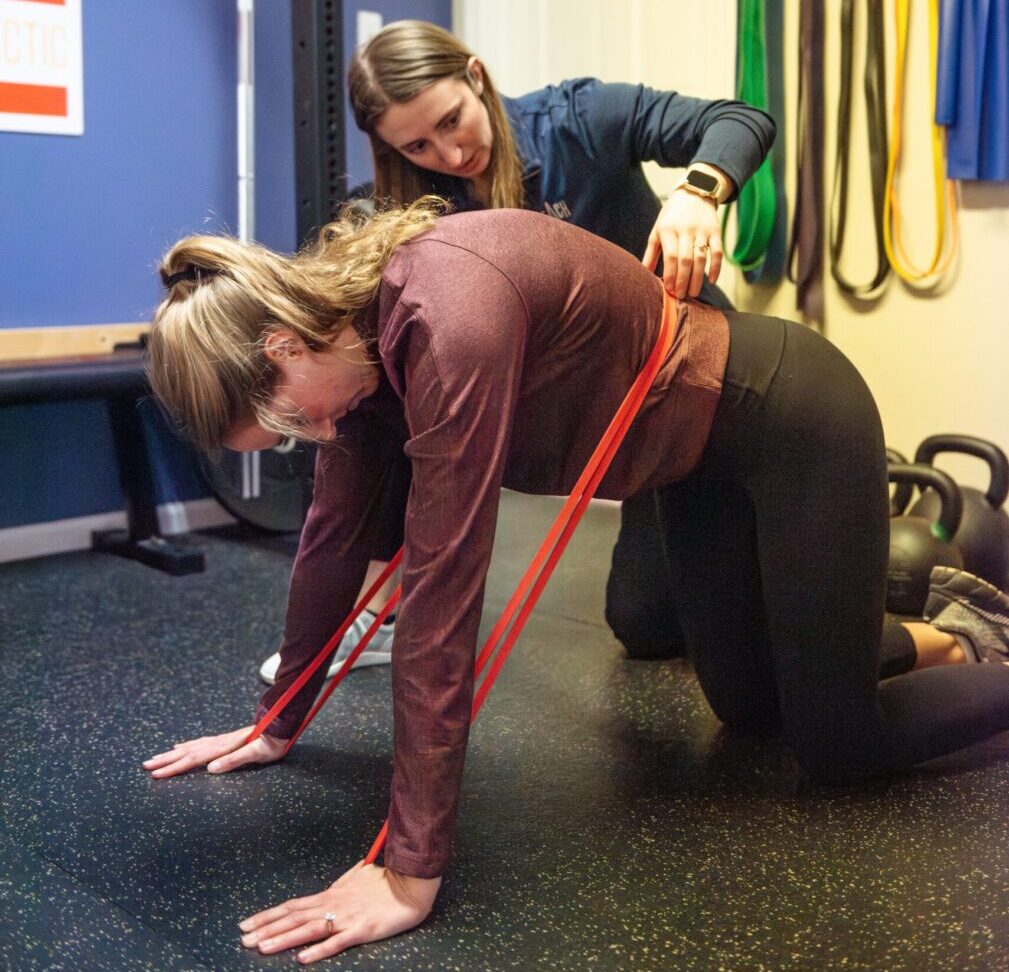 Patient Performing lower back rehab with chiropractor