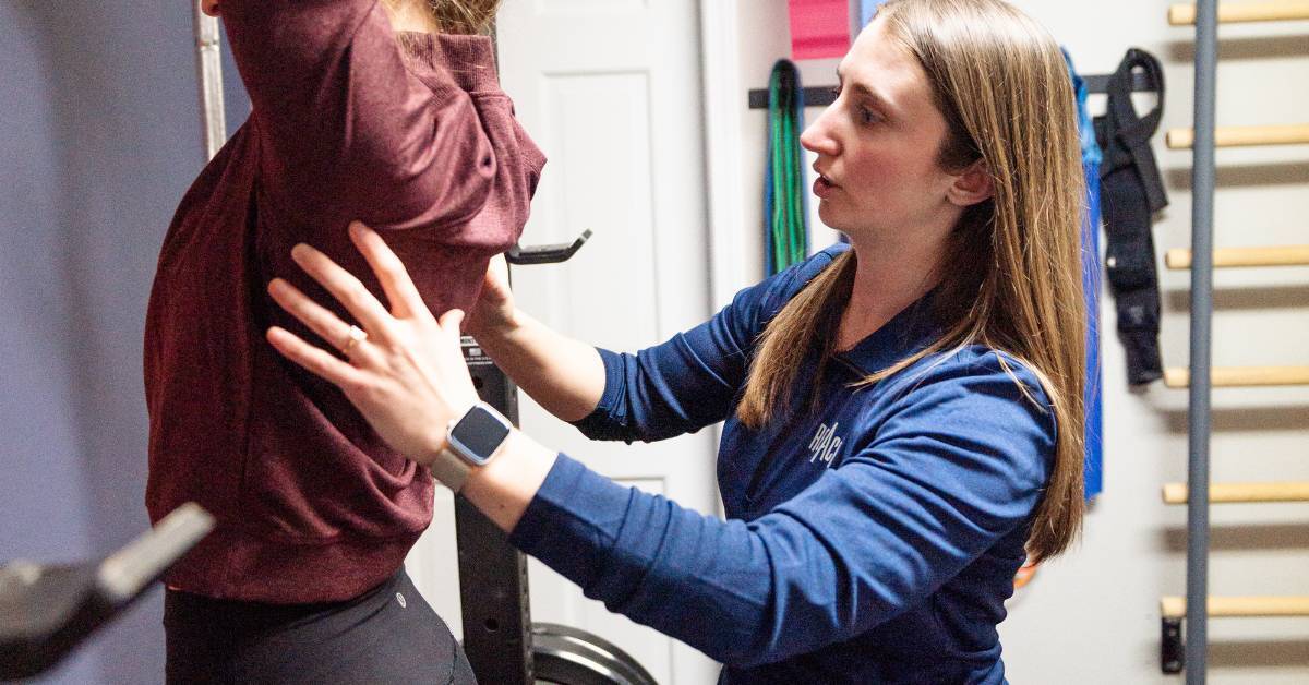 person working with a holistic chiropractor