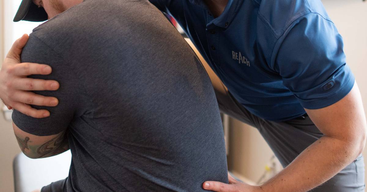 person working with a holistic chiropractor